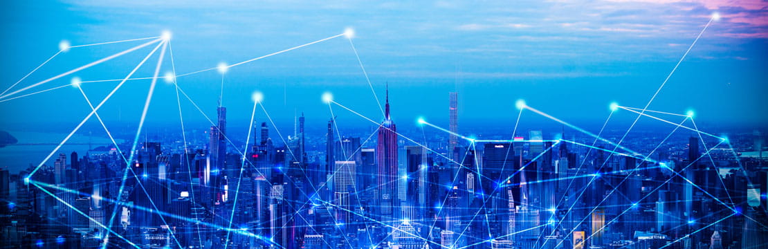 City skyline with digital network lines illustrating connectivity.